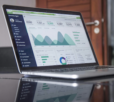 image of laptop showing graphs